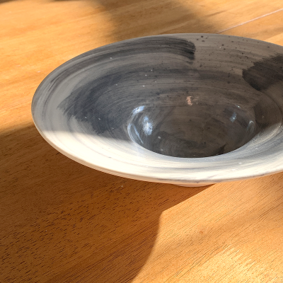 White bowl with blue swirls